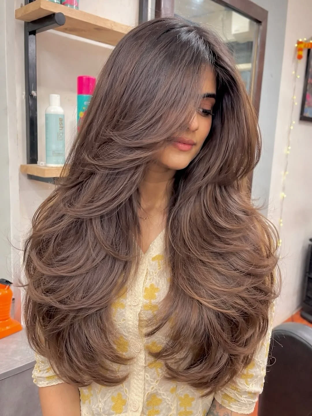 angled summer haircut for round face 2026 + Mocha Butterfly Layers With a Soft Summer Glow