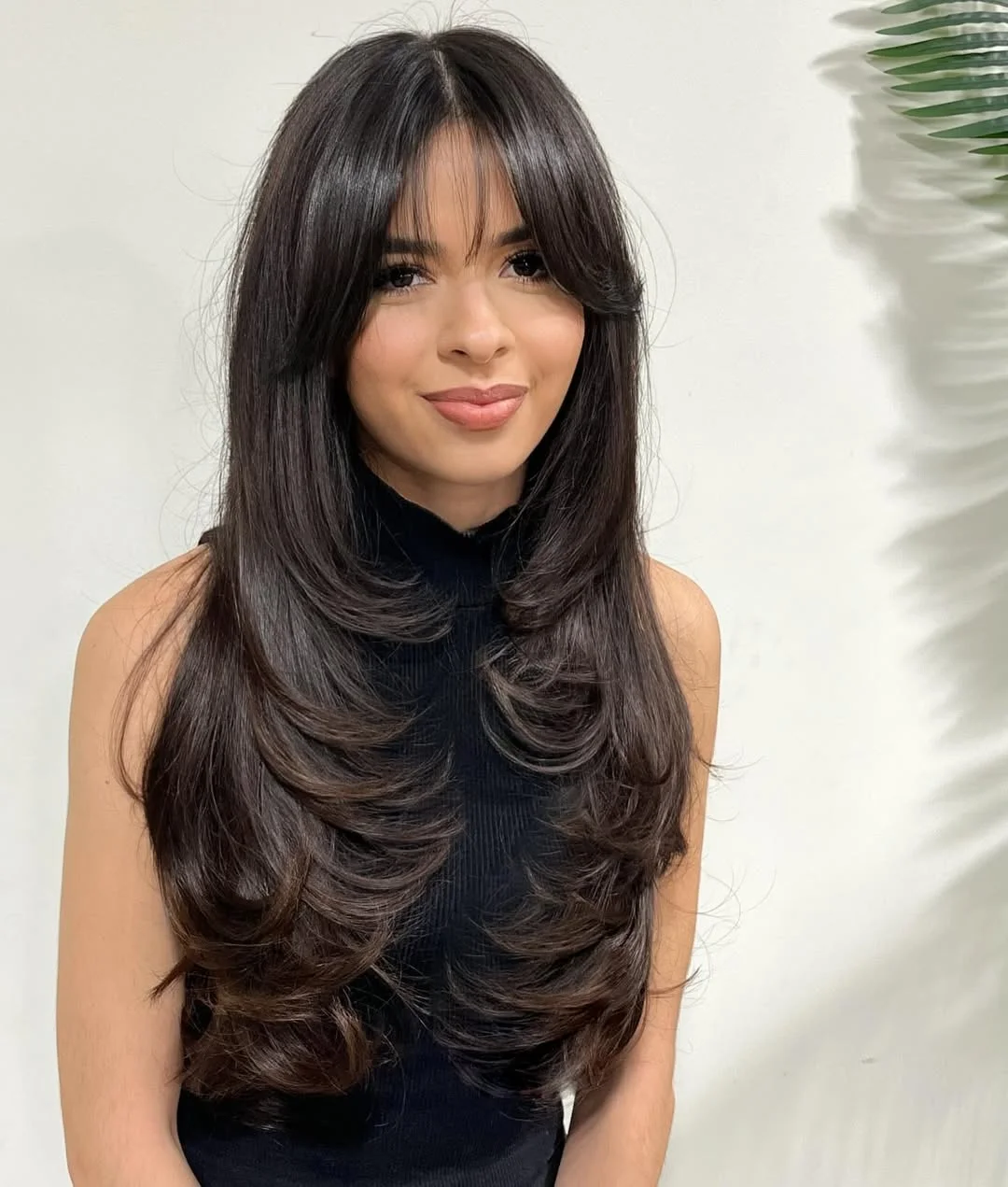 angled summer haircut for round face 2026 + Espresso Curtain Bangs and Cascading Rounded Layers