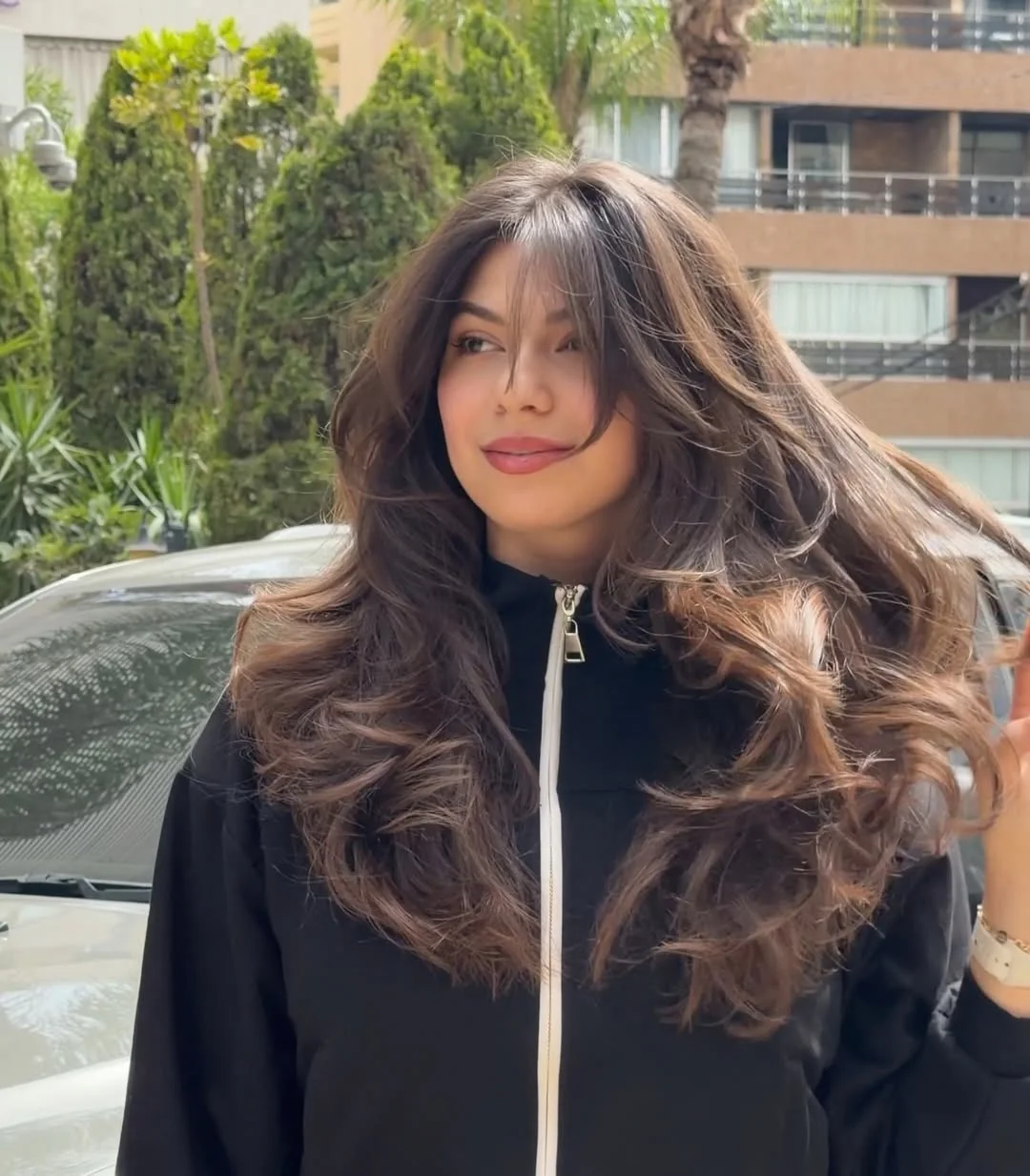 angled summer haircut for round face 2026 + Breezy Curtain Fringe With Sporty Long Layers