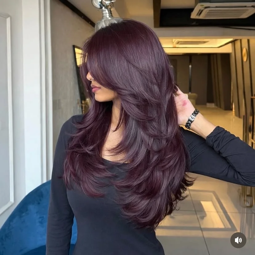 angled summer haircut for round face 2026 + Plum-Tinted Butterfly Layers With a Dramatic Side Sweep