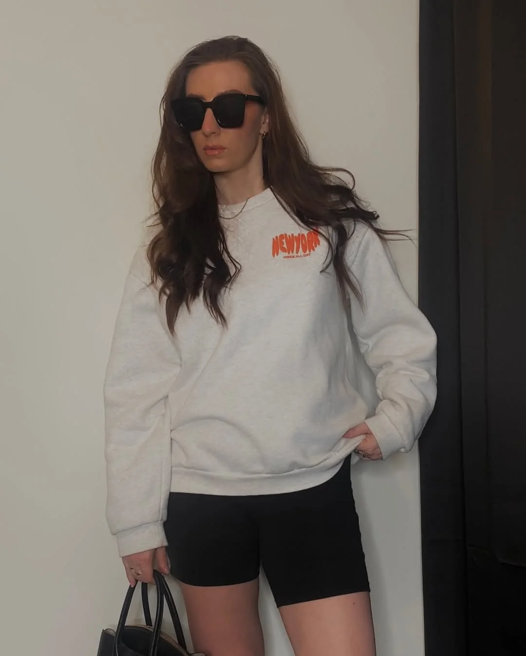 biker shorts outfits summer 2026 Grey Sweatshirt With Black Biker Shorts For Cool Summer Evenings