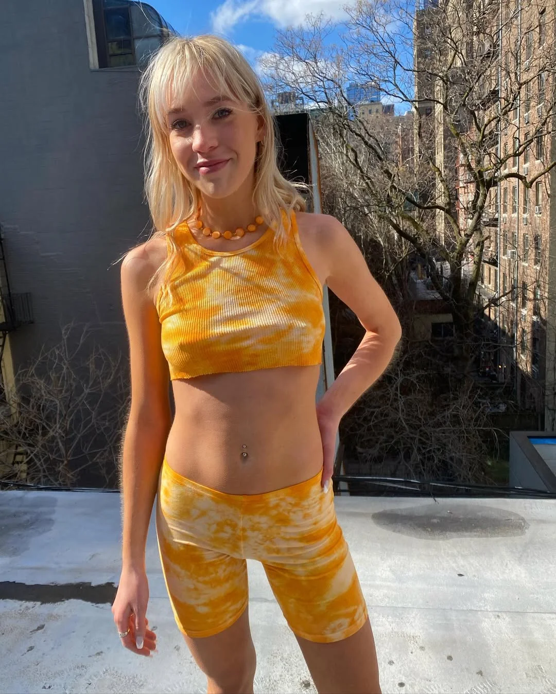 biker shorts outfits summer 2026 Yellow Tie-Dye Biker Shorts Set With A Rooftop Mood