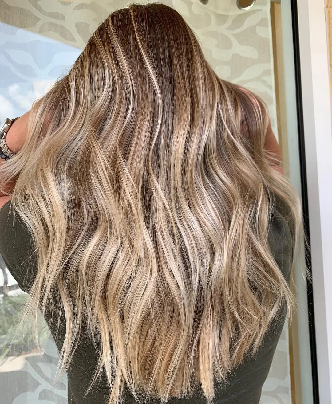 bright summer blonde hair color 2026 + Beachy Beige Balayage Through Cascading Lengths