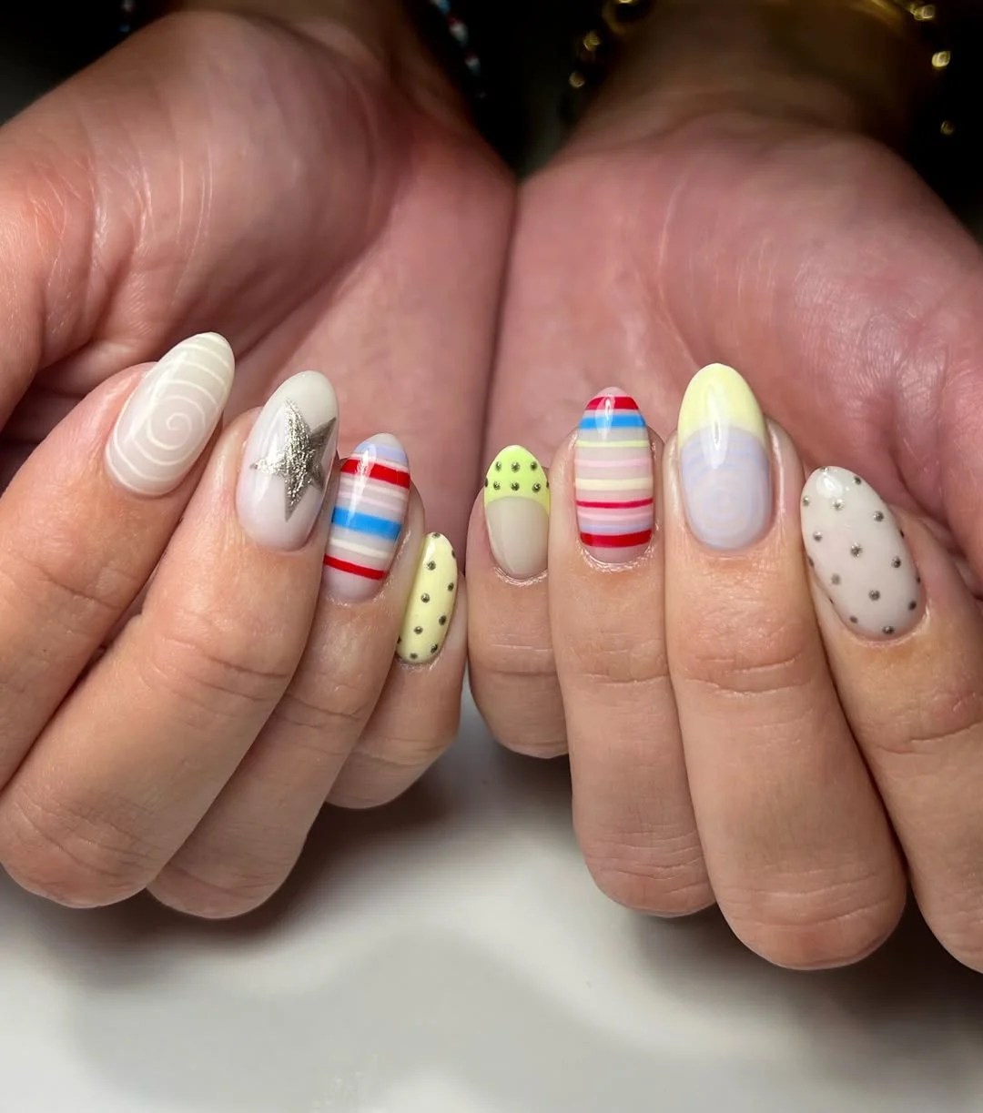 bright summer nails 2026 + Pastel Carnival Almond Nails With Silver Accents