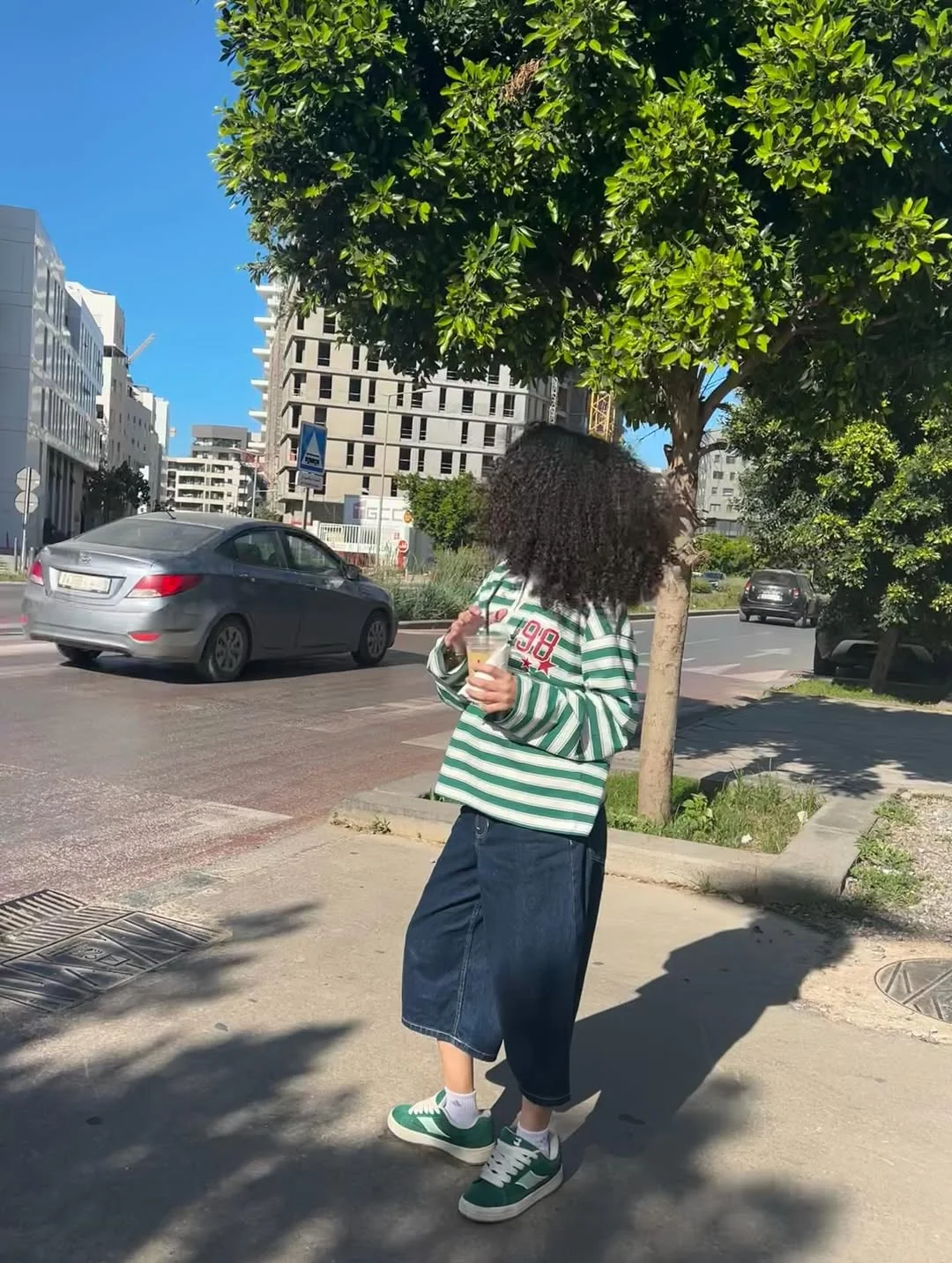 casual friday summer outfits with sneakers 2026 Striped Rugby Shirt With Green Sneaker Energy