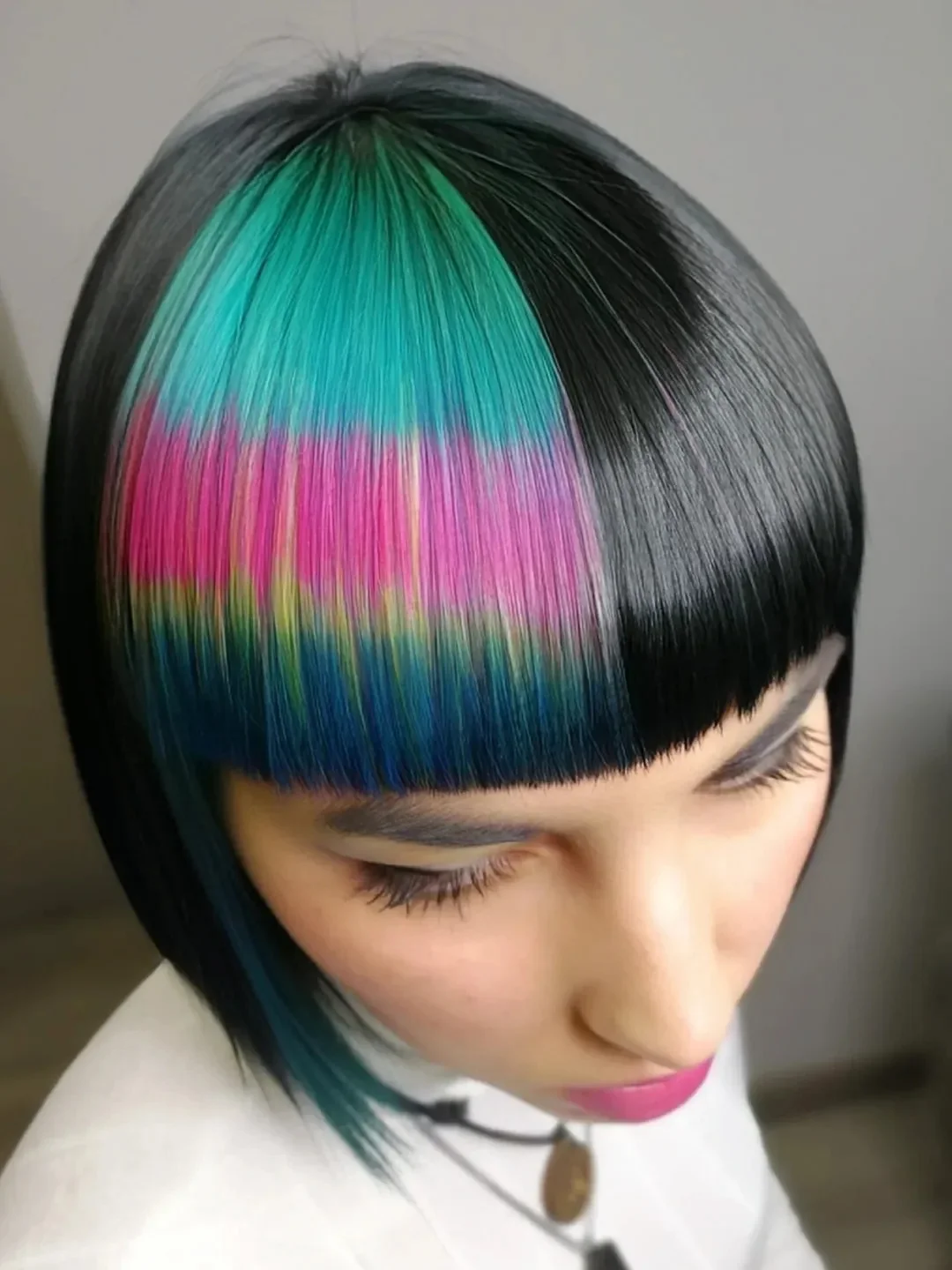cute summer hair color ideas 2026 + Rainbow Panel Bangs on a Sleek Black Bob
