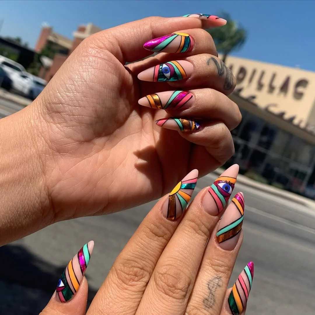 funky summer nails 2026 + Graphic Eye Art on Dramatic Almond Tips