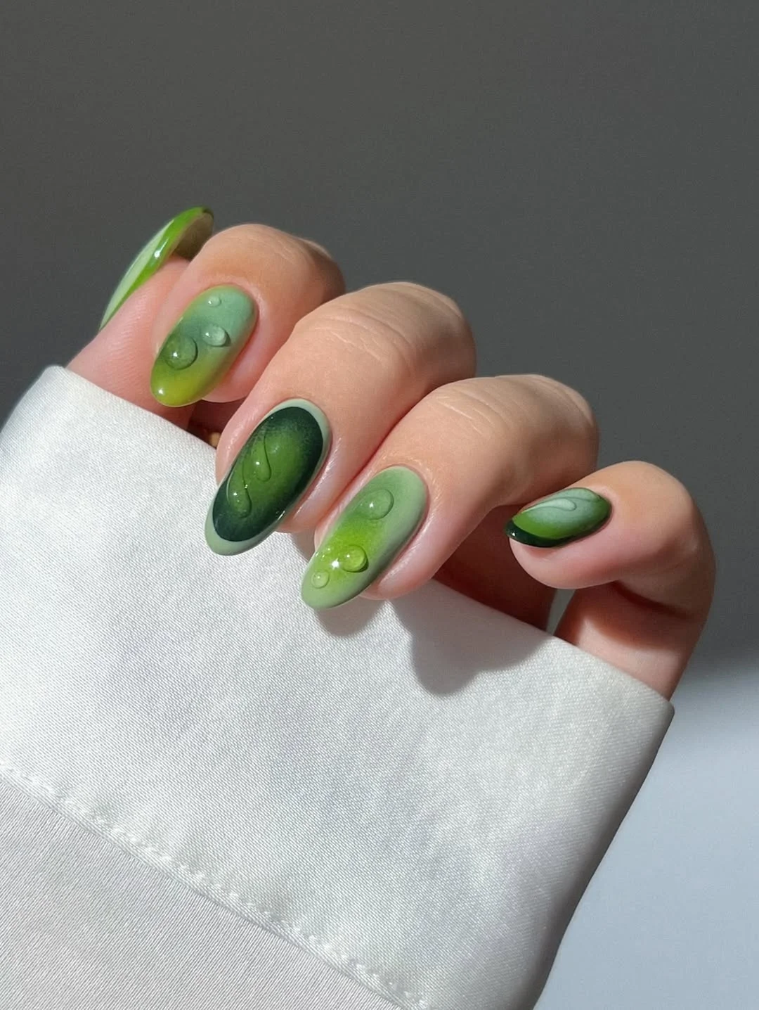 June Nail Colors ideas - Summer Trends 2026 Deep Olive Aura Nails With Glossy Water Droplets