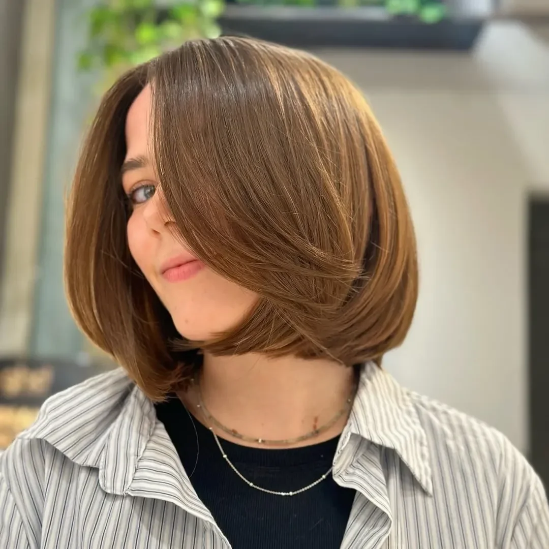 layered summer bob haircut 2026 Warm Caramel Bob With A Sleek Side-Swept Finish