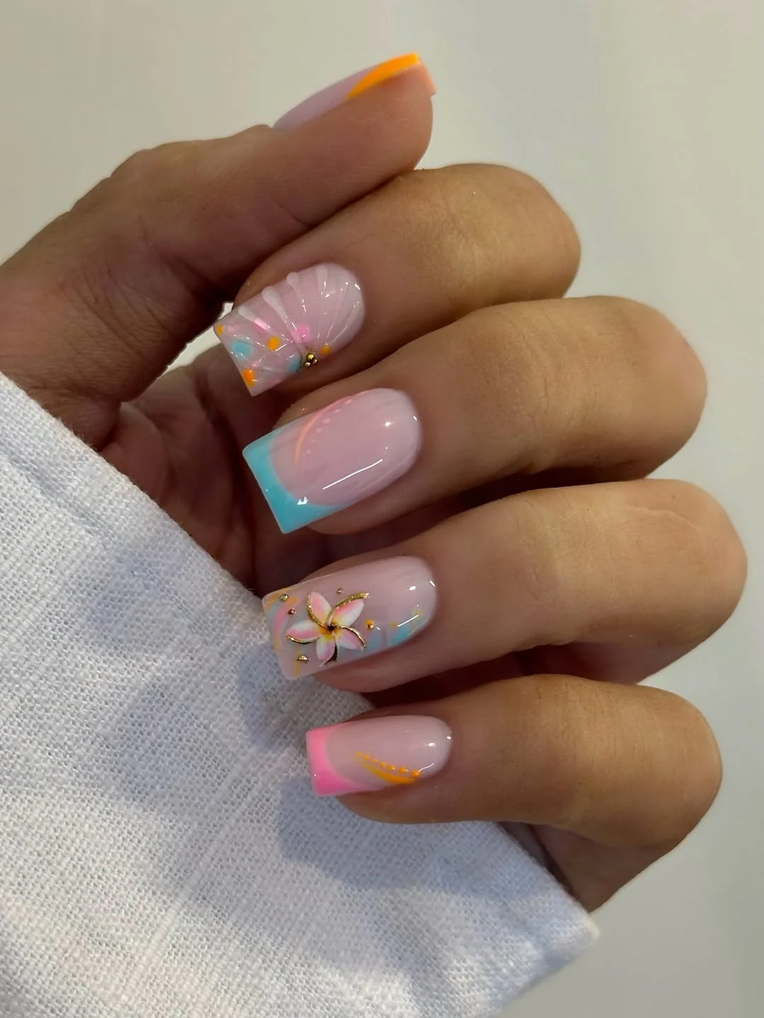 light summer nails 2026 + Pastel Tropical French Tips with Sculpted Flowers