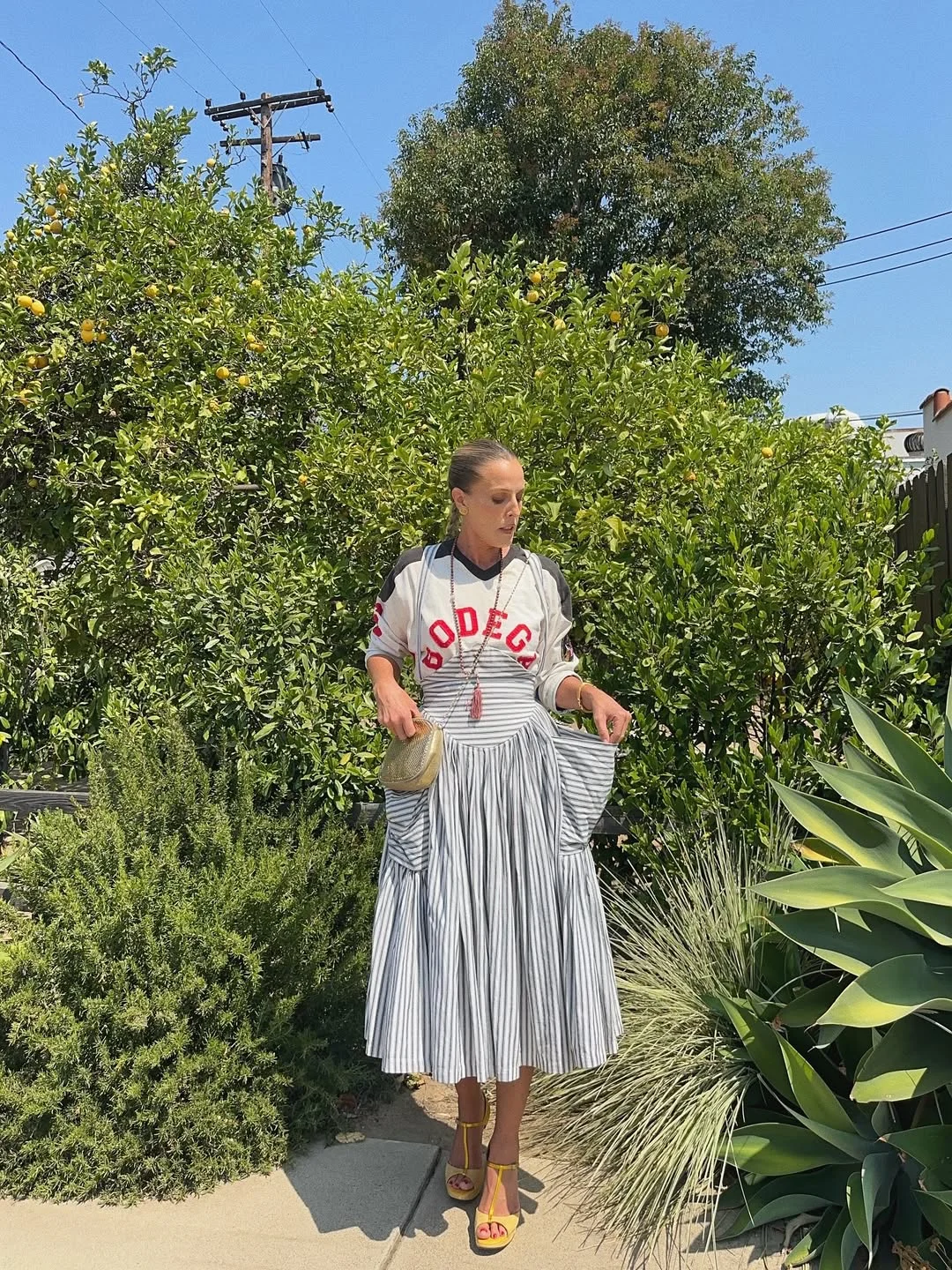 maxi skirt outfits summer 2026 Striped Maxi Skirt With A Sporty Graphic Top