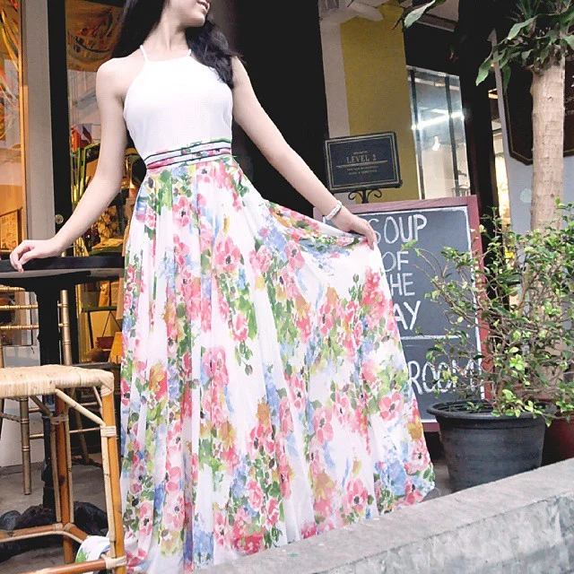 maxi skirt outfits summer 2026 White Halter Top With A Floral Maxi Skirt