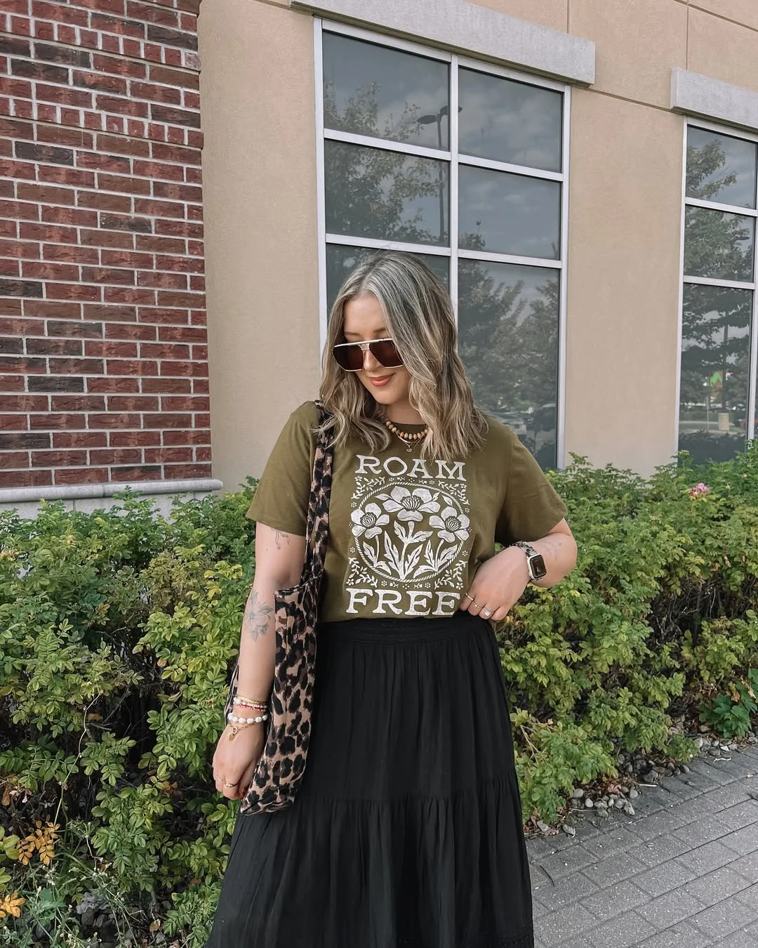 maxi skirt outfits summer 2026 Olive Graphic Tee With A Black Tiered Maxi Skirt
