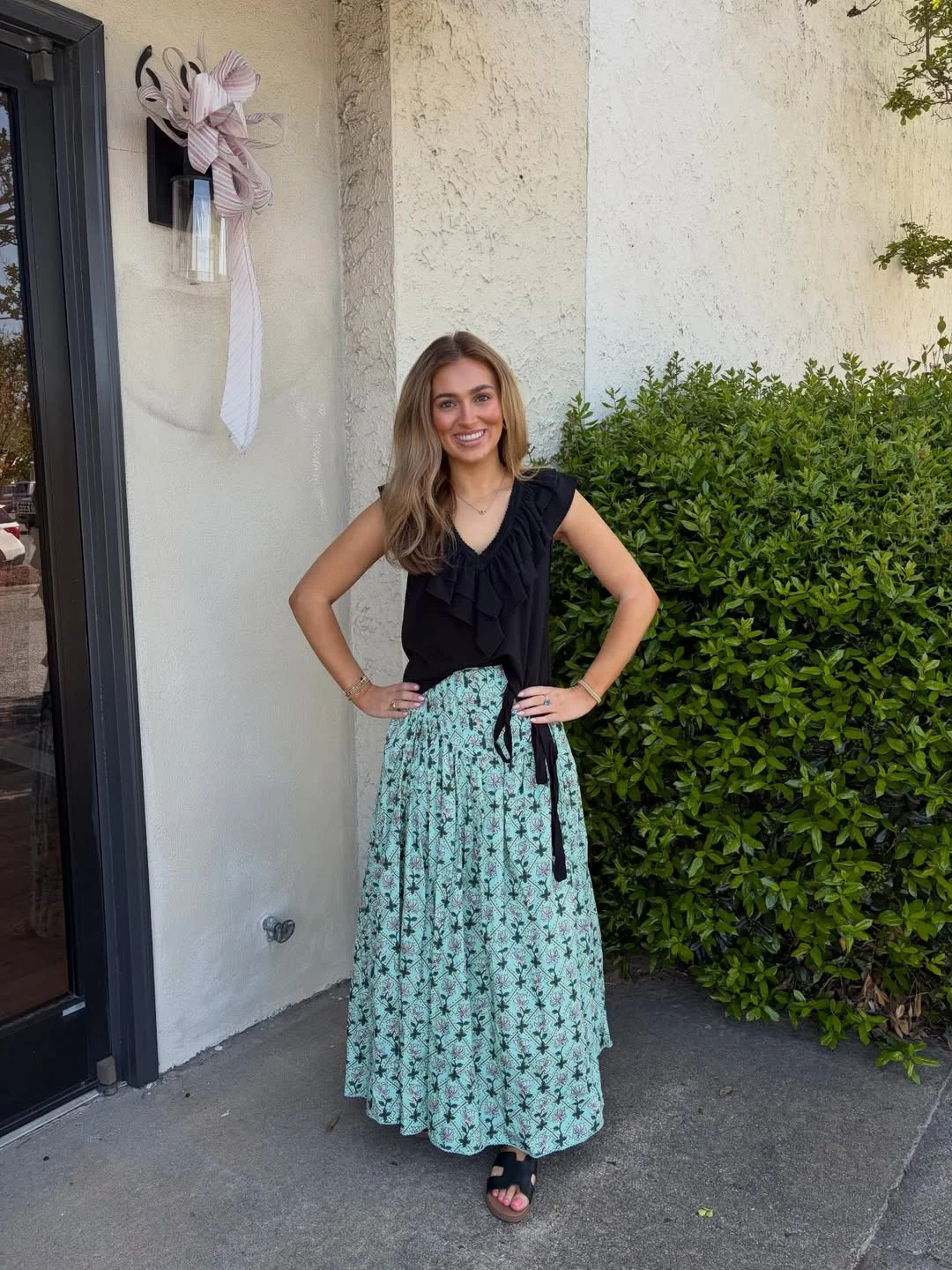 maxi skirt outfits summer 2026 Black Ruffle Top With A Green Printed Maxi Skirt