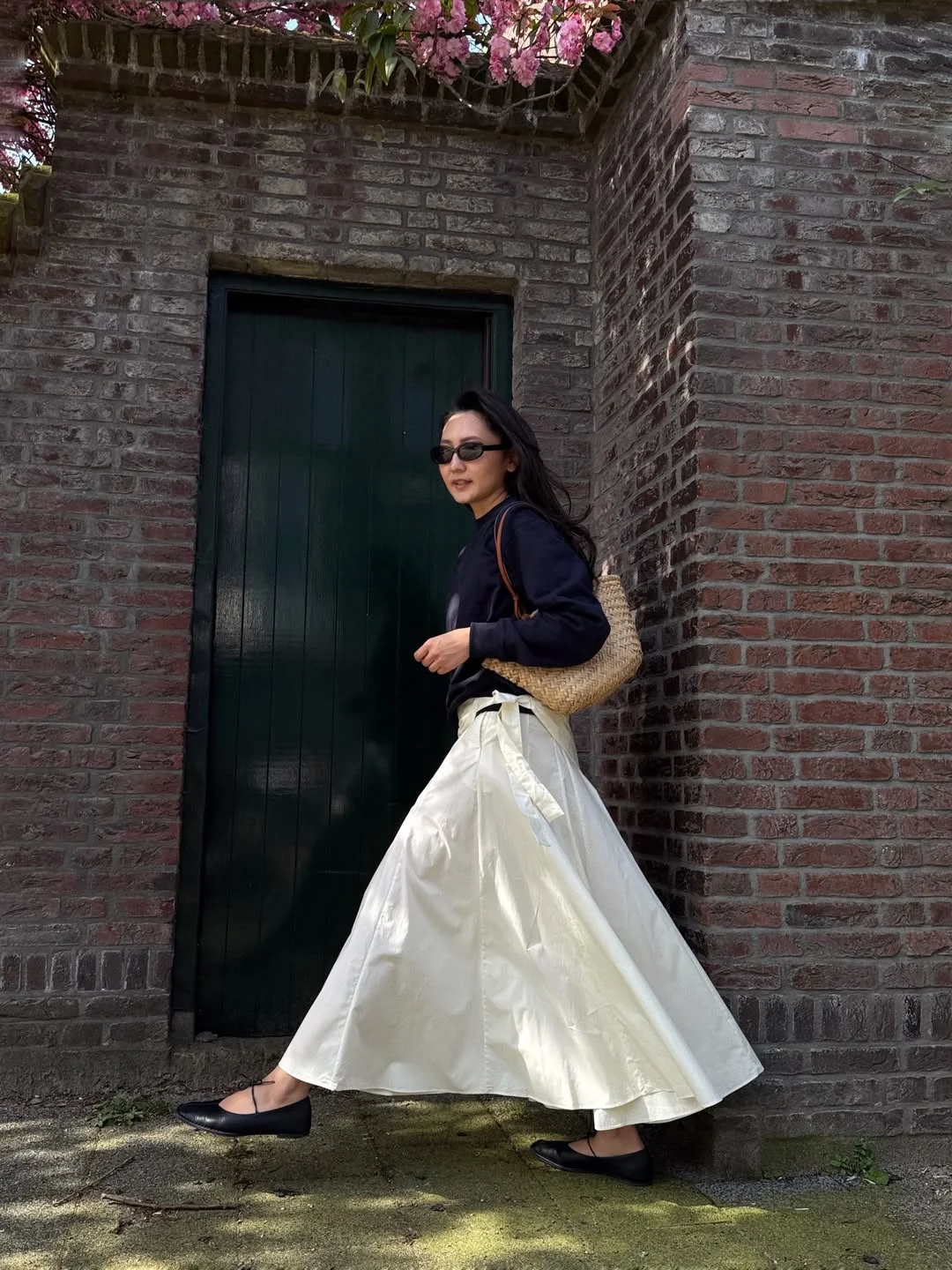 maxi skirt outfits summer 2026 Navy Sweatshirt With A White Maxi Skirt And Ballet Flats