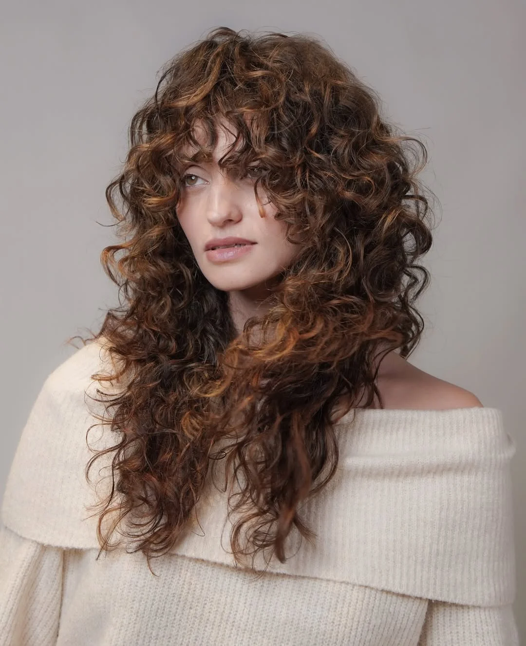 messy summer shag haircut 2026 Romantic Curly Shag With Off-Shoulder Ease