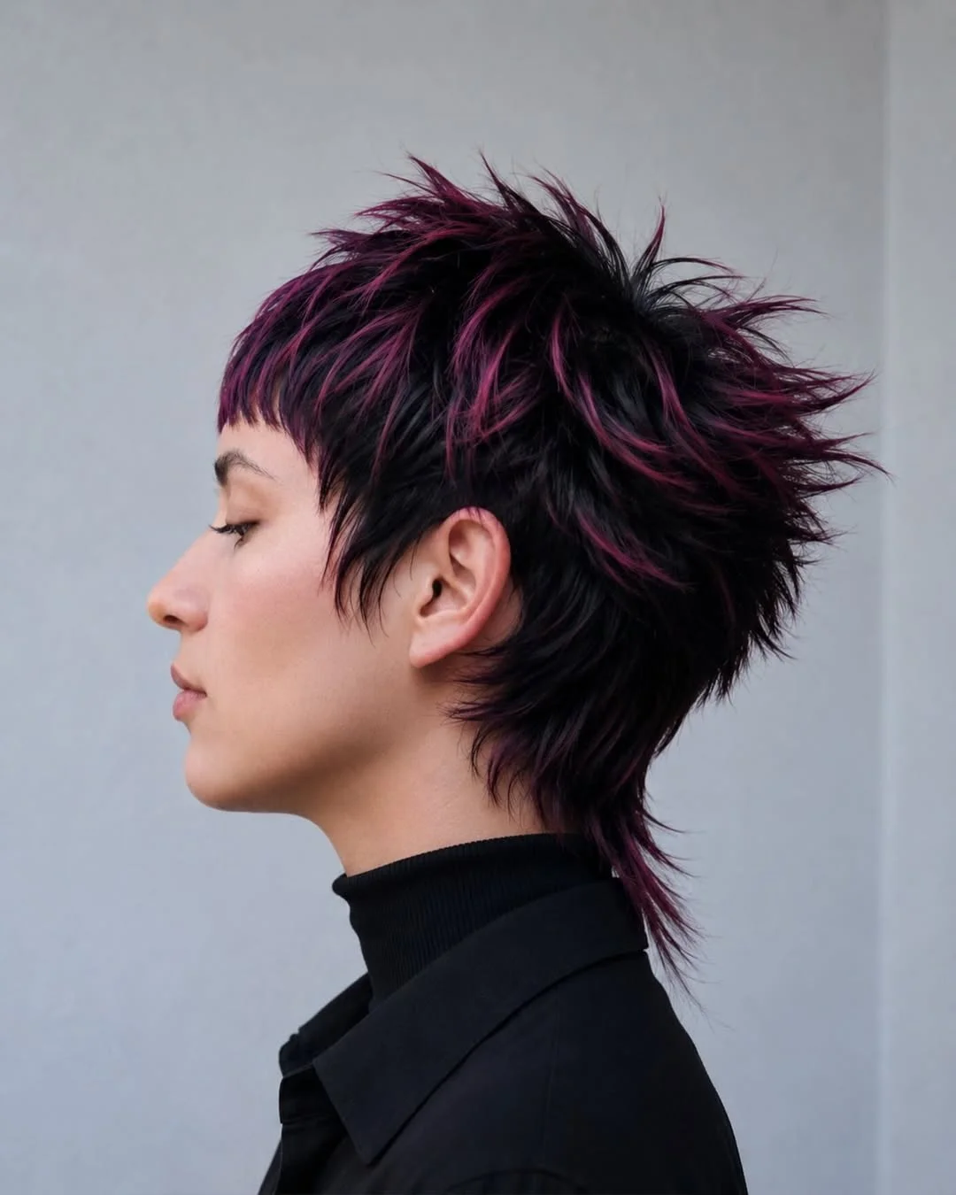 modern summer haircut 2026 Spiky Black Pixie Mullet With Berry Highlights