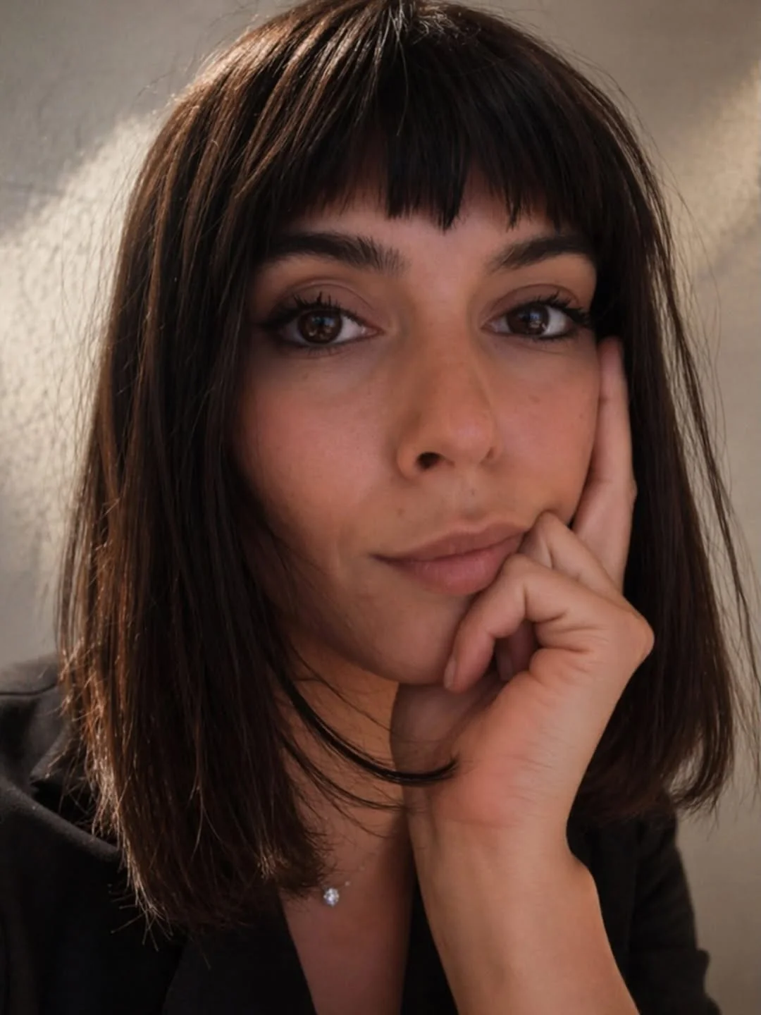 modern summer haircut 2026 Sleek Brunette Bob With Blunt Baby Bangs