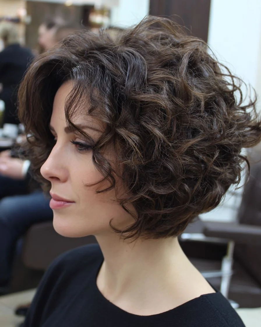 modern summer haircut 2026 Voluminous Curly Bob With Soft Definition