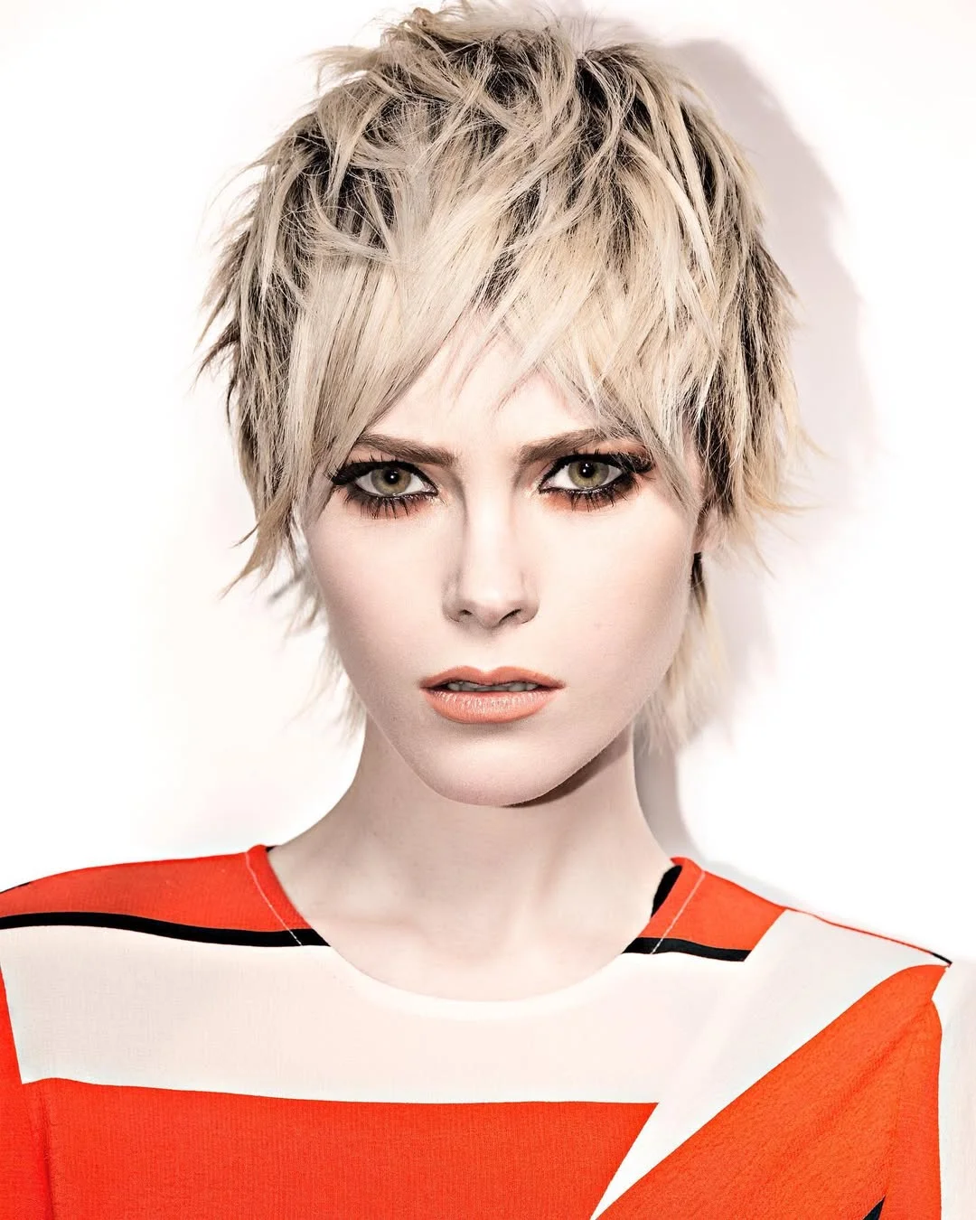 modern summer haircut 2026 Platinum Shaggy Pixie With Soft Punk Texture
