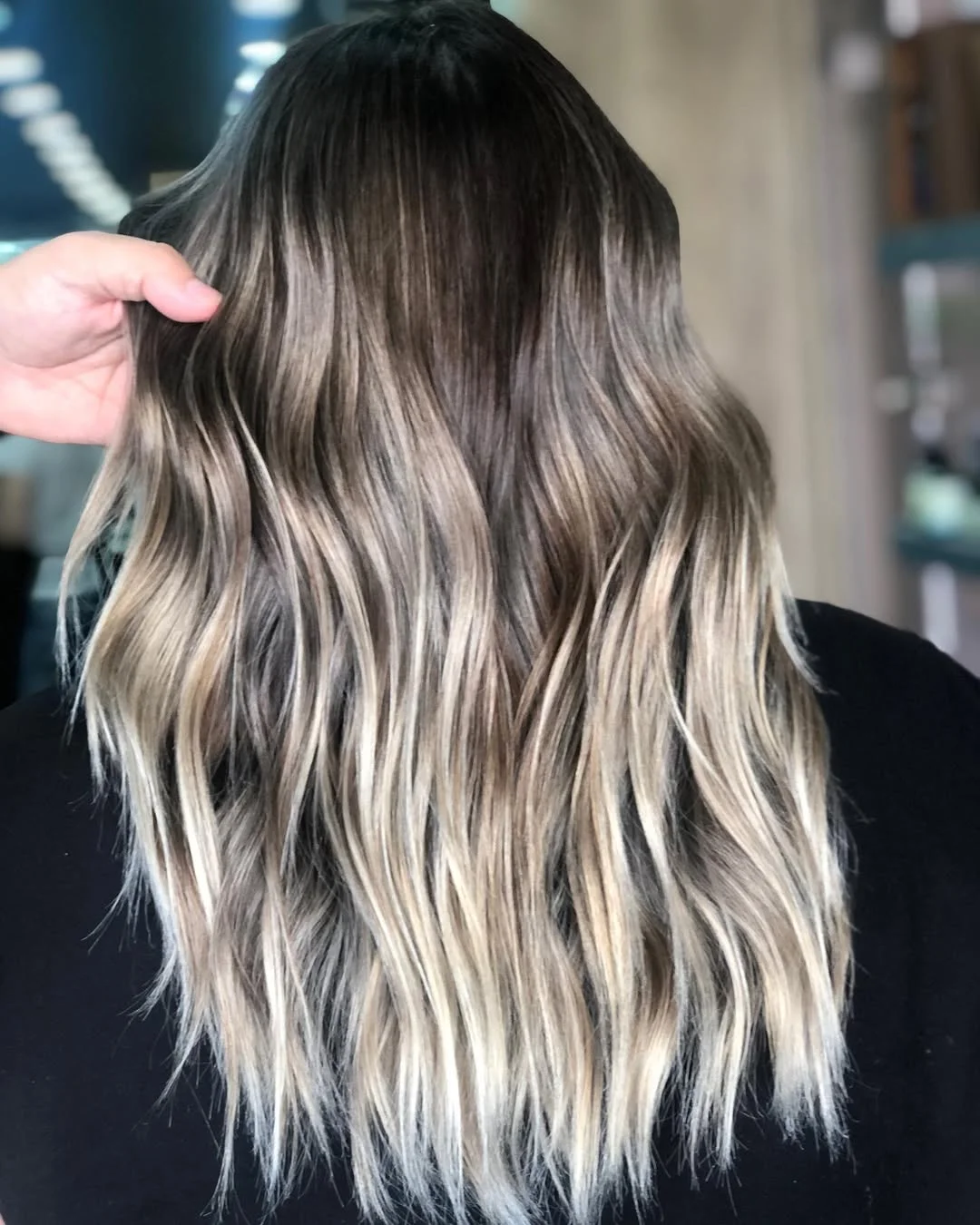 modern summer haircut 2026 Smoky Blonde Waves With Long Shattered Ends