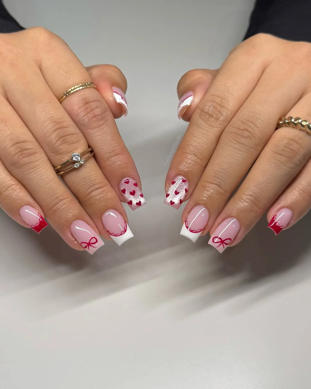 short squoval nails design 2026 + Red Bow French Tips with Heart Confetti Accents