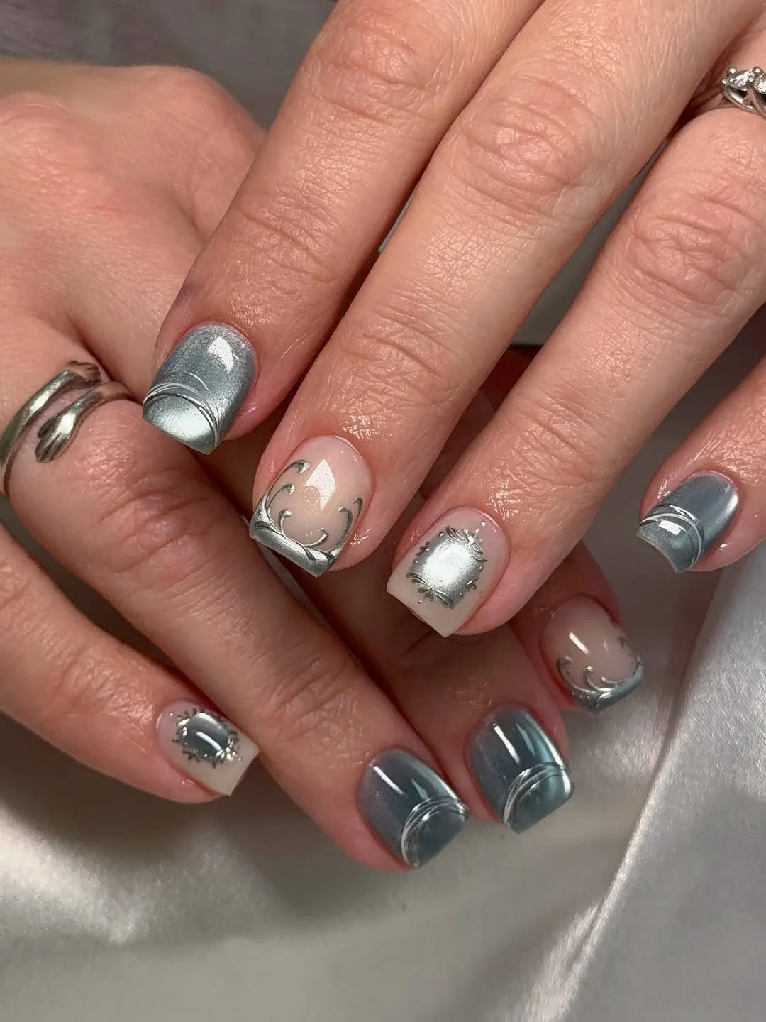 short squoval nails design 2026 + Silver Chrome Squoval Nails with Sculpted Metal Details