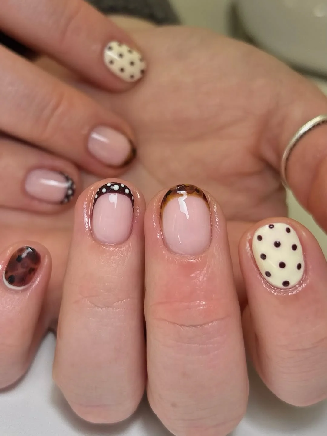 short squoval nails design 2026 + Chocolate Tortoiseshell and Polka Dot Short Nails
