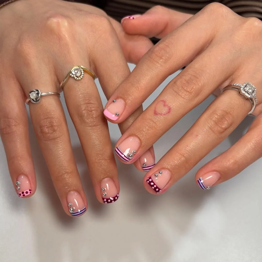 short squoval nails design 2026 + Playful Micro French Tips with Plum Dots and Sparkle