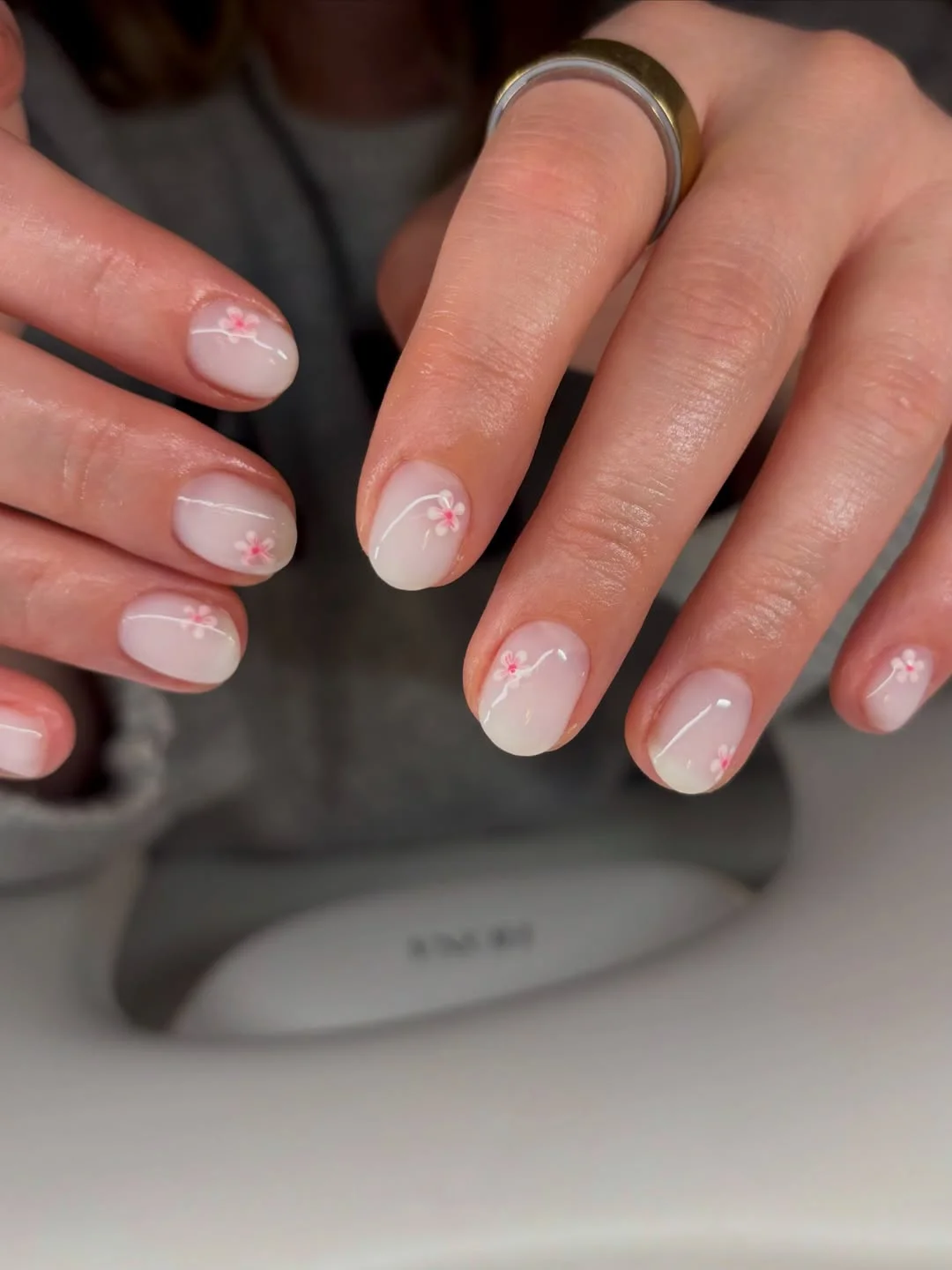 short squoval nails design 2026 + Milky Floral Short Nails with Whisper Thin Stems