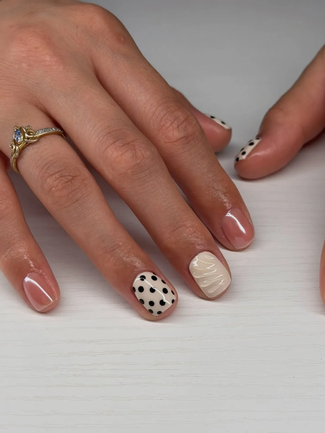 short squoval nails design 2026 + Ivory Polka Dots and Nude Gloss on Short Rounded Nails