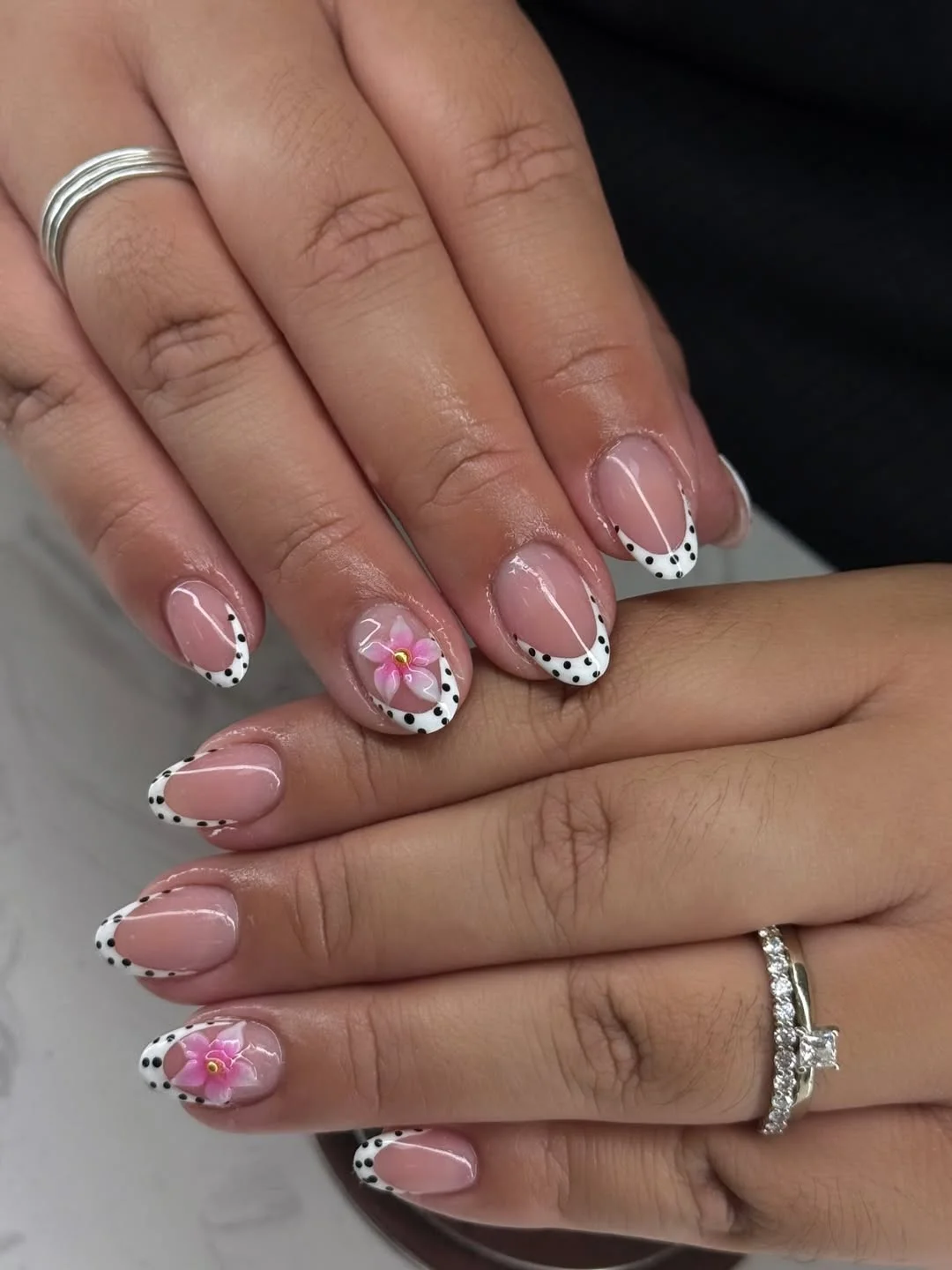 short squoval nails design 2026 + Polka Dot French Tips with Pink Blossom Accents