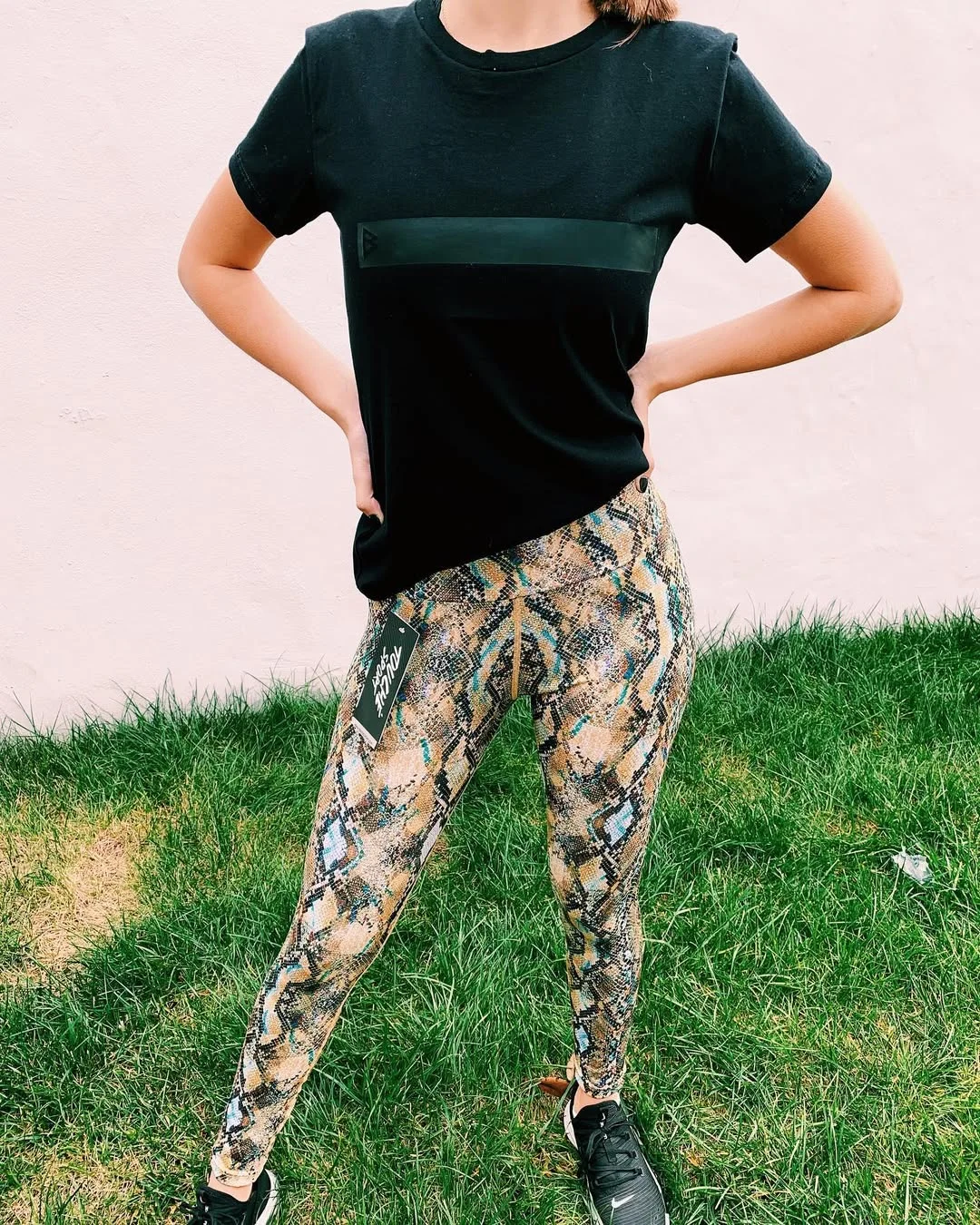 sporty legging outfits summer 2026 Snake Print Leggings With A Grounded Black Tee