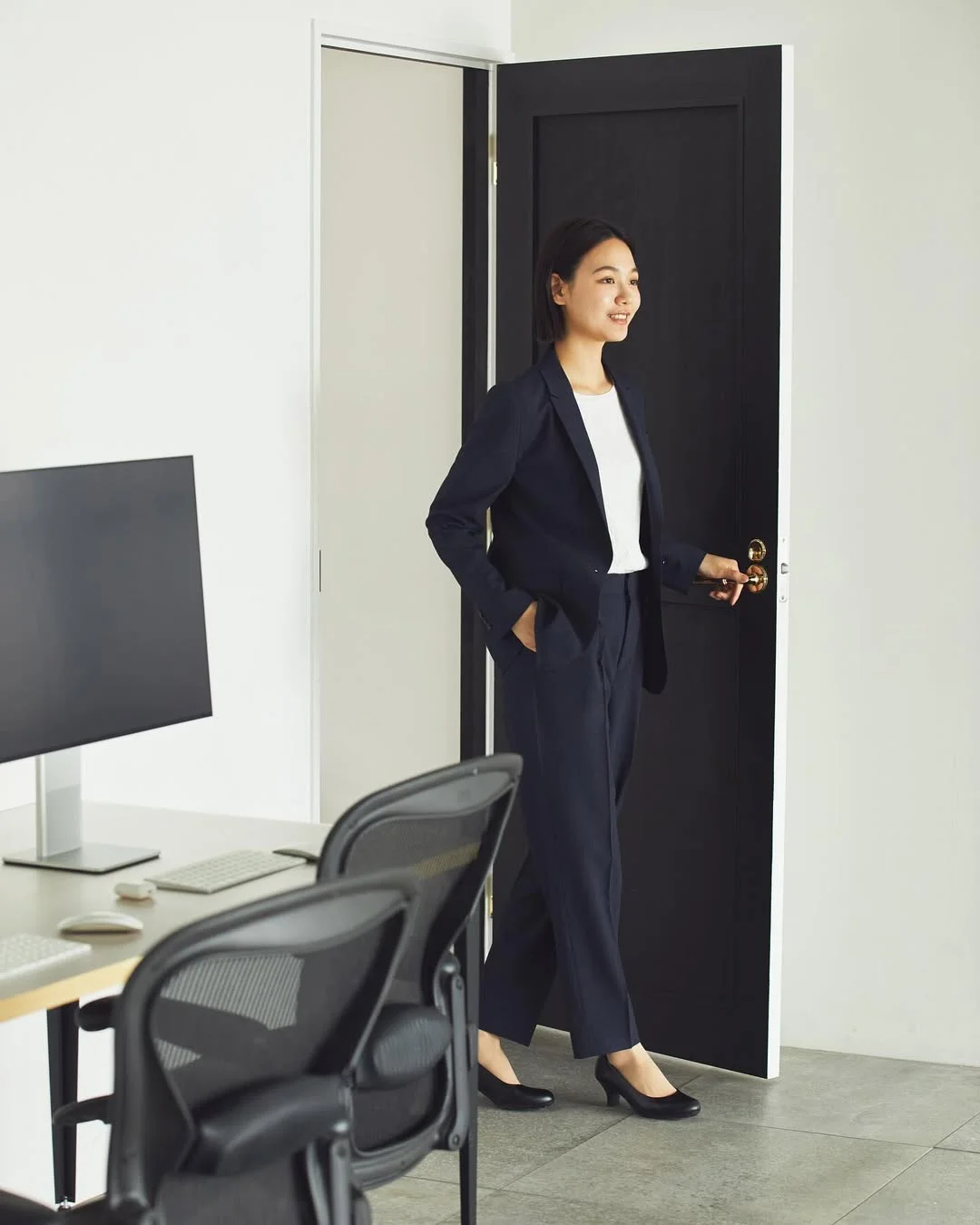 summer business casual outfit 2026 Navy Suiting With A White Tee And Classic Pumps