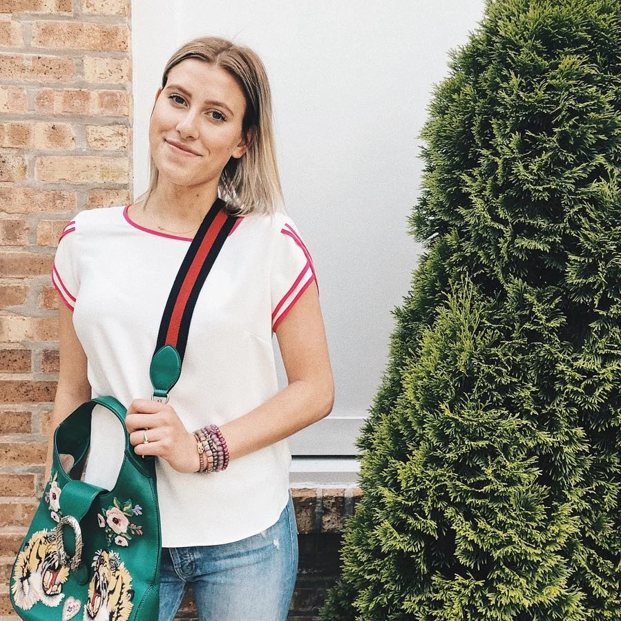 summer clothes essentials 2026 White Tee With Pink Trim And A Statement Green Bag