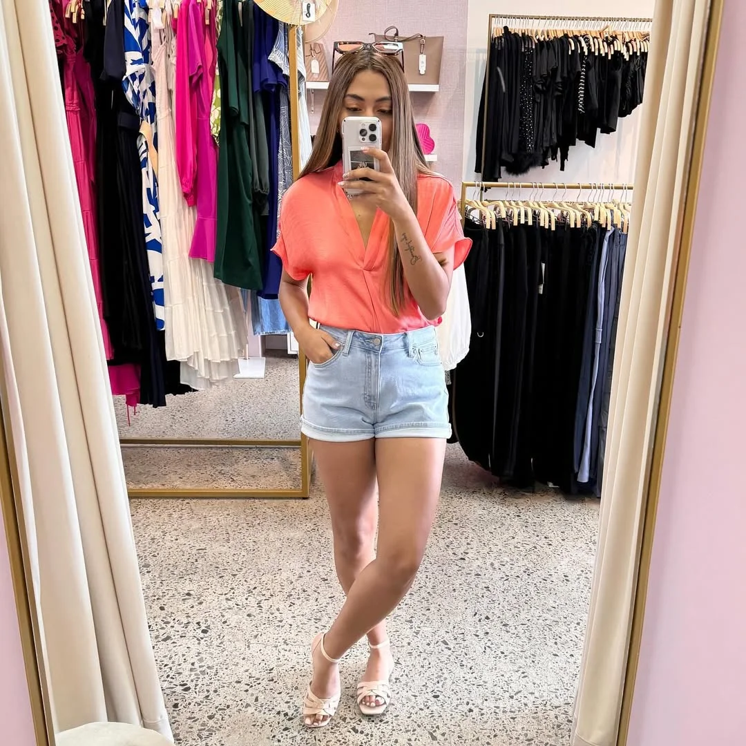 summer denim shorts 2026 Coral Blouse With Cuffed Shorts For An Easy Polished Finish