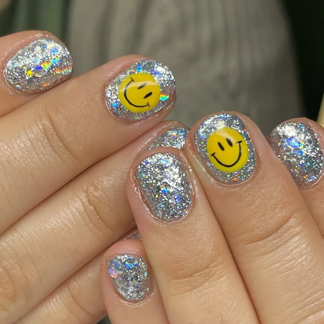 summer glitter nails 2026 + Silver Smiley Glitter Nails for a Playful Summer Mood