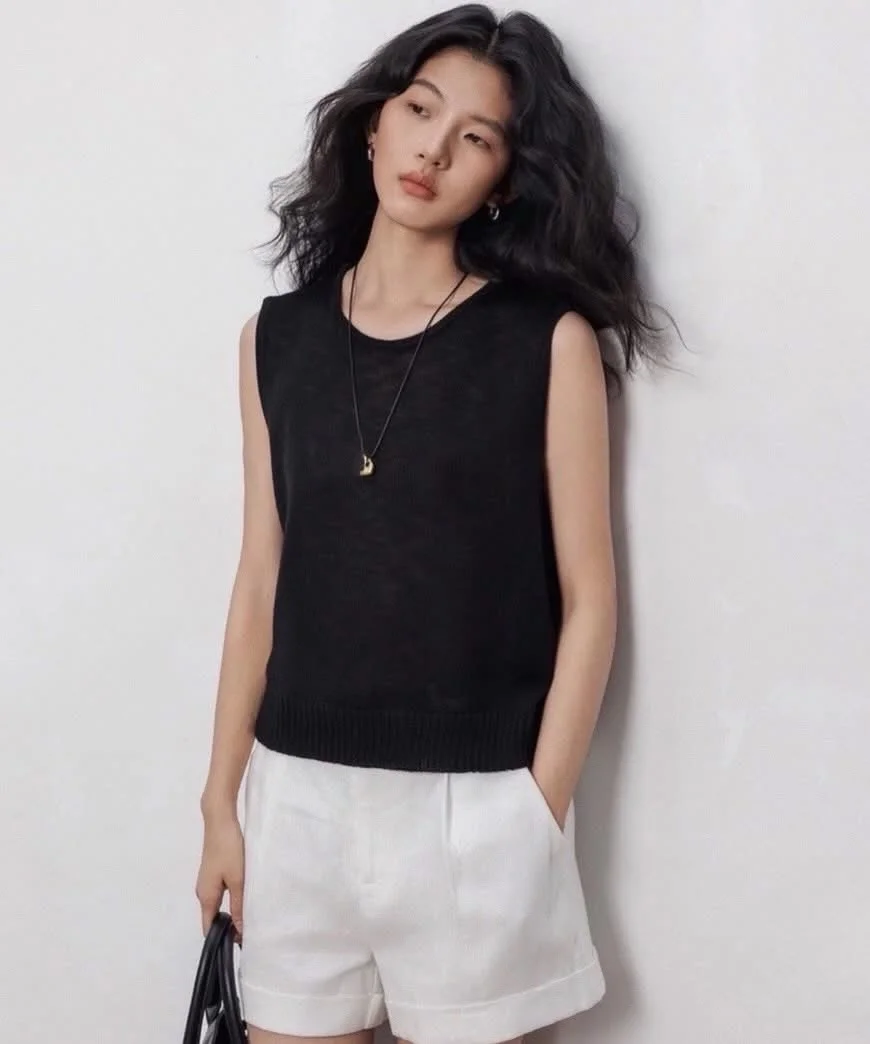 summer sleeveless tops 2026 Black Knit Shell With Tailored White Shorts