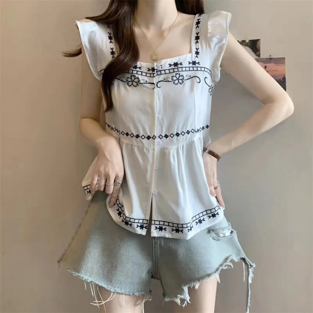 summer sleeveless tops 2026 White Embroidered Blouse With Frayed Denim Shorts