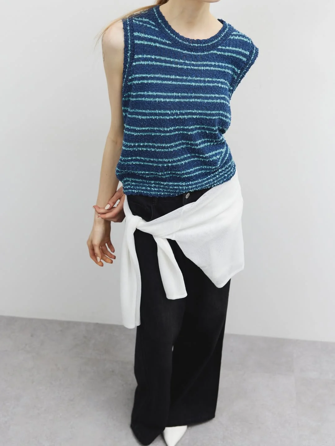 summer sleeveless tops 2026 Blue Striped Knit With Black Trousers And A Waist Tie