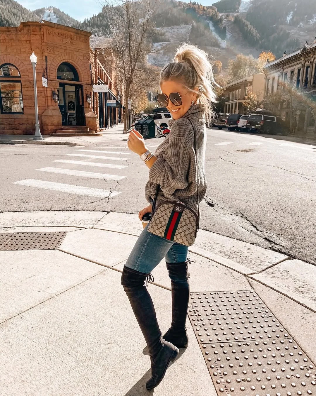 comfortable fall travel outfits 2026 Cozy Sweater, Jeans, And Tall Boots For Mountain-Town Exploring