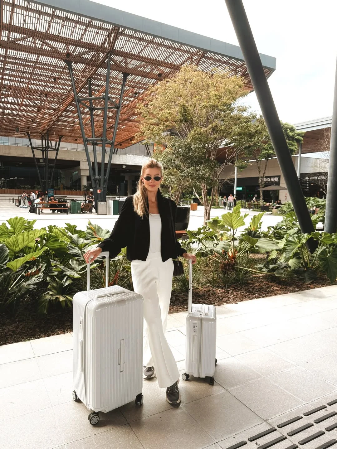 comfortable fall travel outfits 2026 Black Jacket And White Trousers For A Crisp Arrival