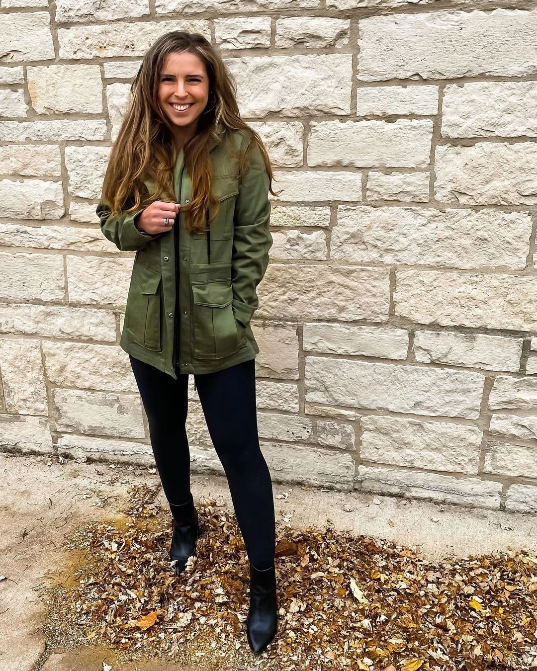 comfortable fall travel outfits 2026 Olive Utility Jacket With Black Leggings And Boots