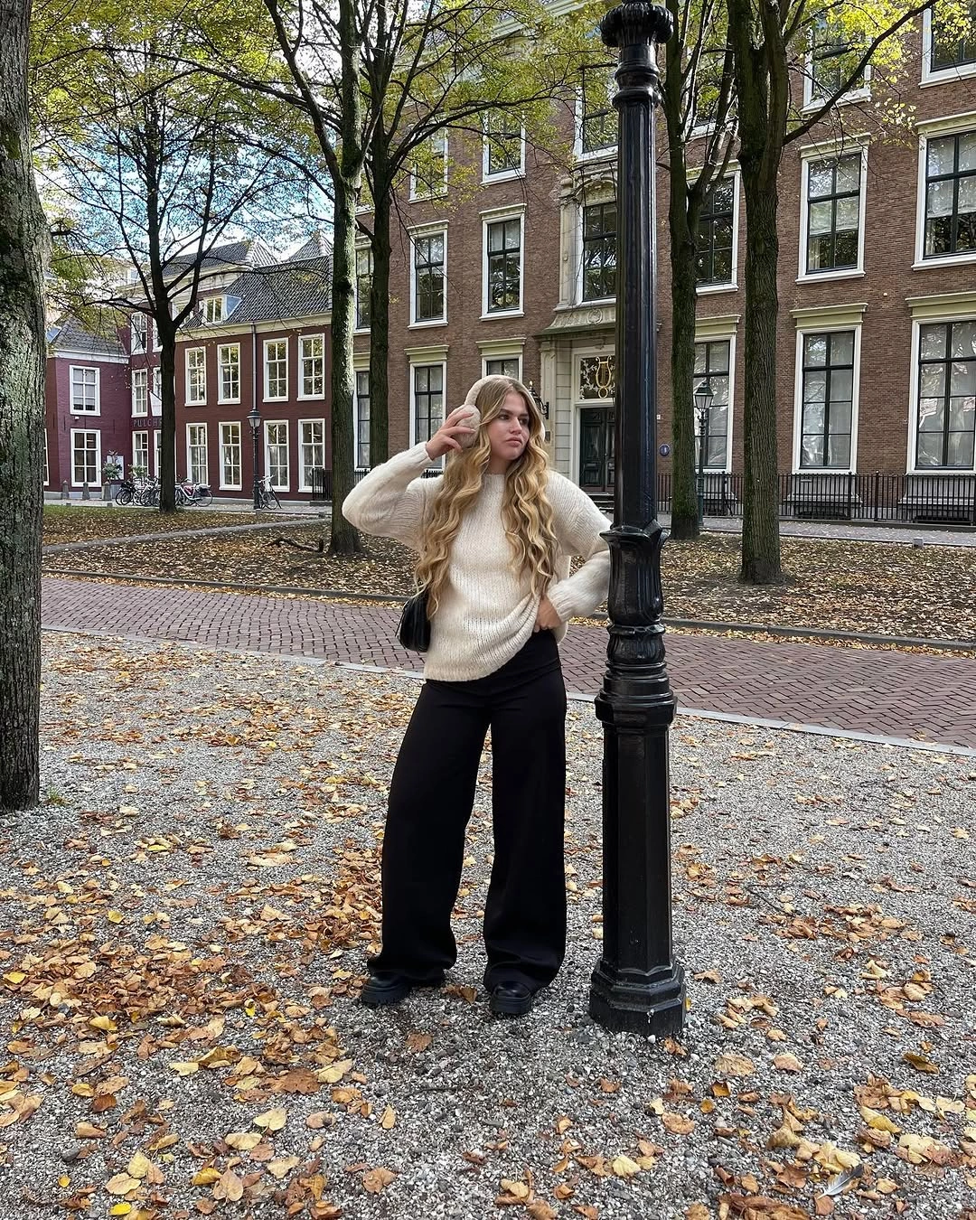 comfy fall outfits 2026 Cream Knitwear and Black Wide-Leg Pants for a Minimalist City Day