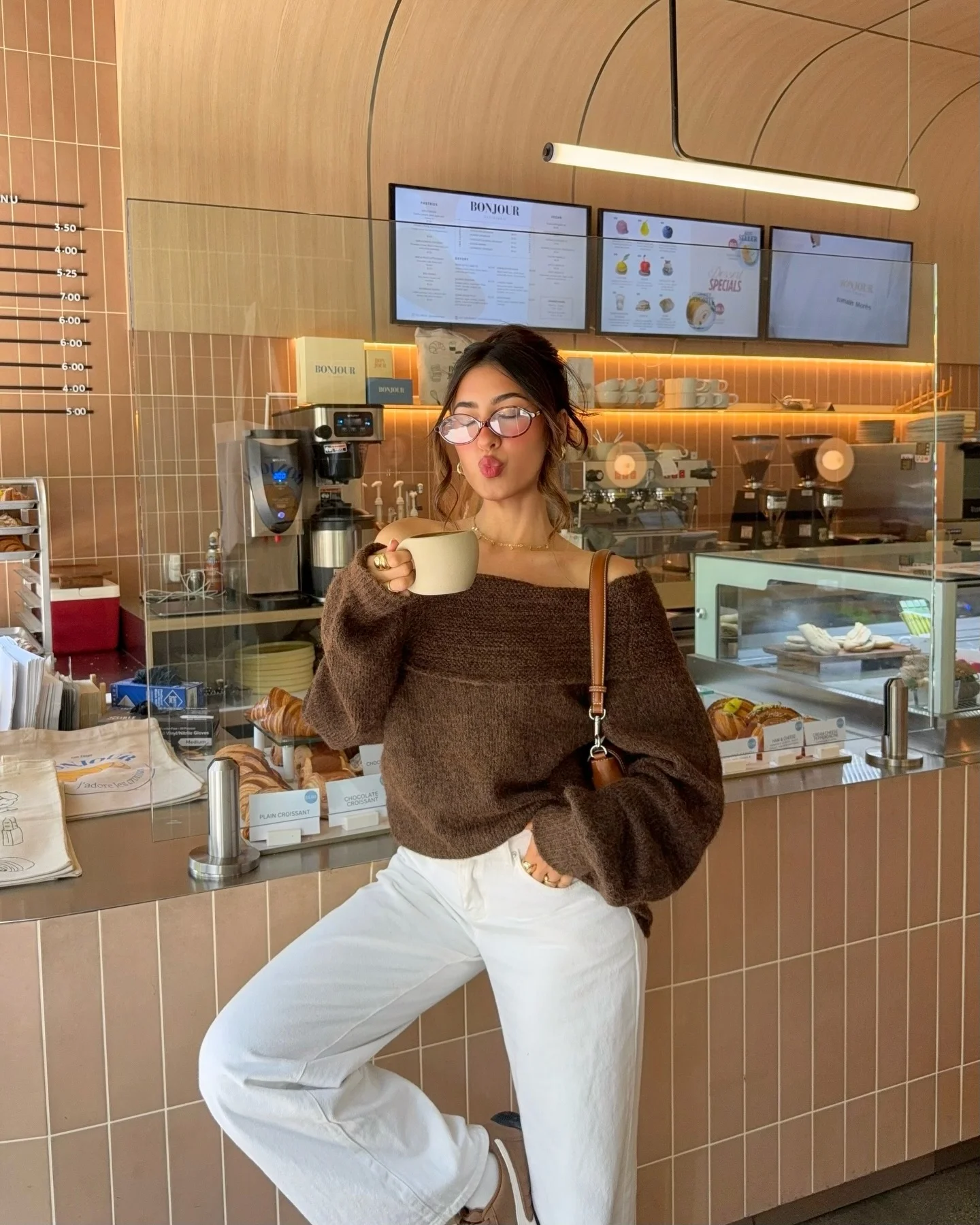 cozy & chic autumn outfits for women 2026 A Chocolate Knit and Cream Denim Look for Café Mornings