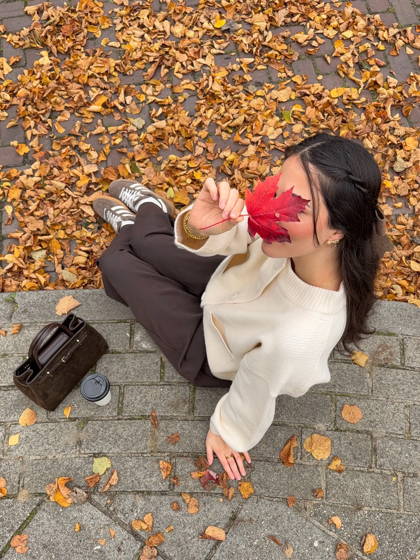 cozy & chic autumn outfits for women 2026 Cream Knitwear and Chocolate Trousers for a Cozy Coffee Break