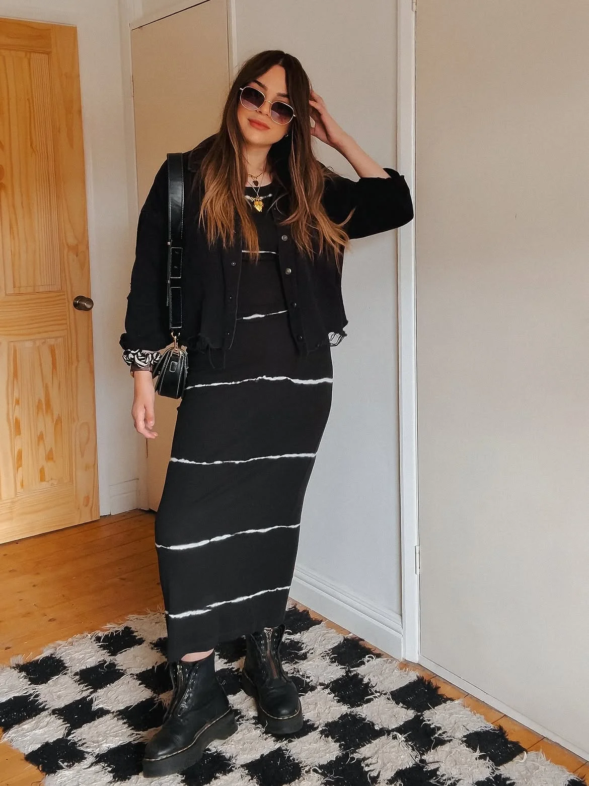 cute fall outfits docs 2026 A Black Maxi Dress With Street-Ready Boots