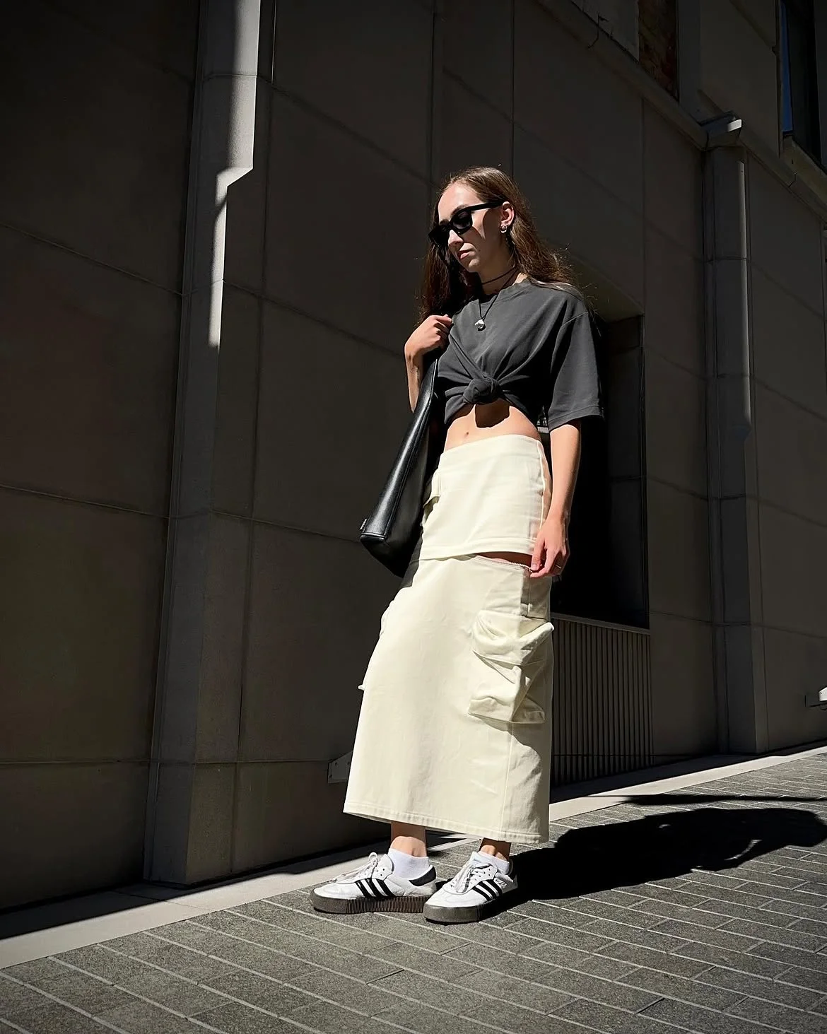 early fall outfits 2026 + Black Crop Top and Cream Cargo Skirt for a Modern Casual Look