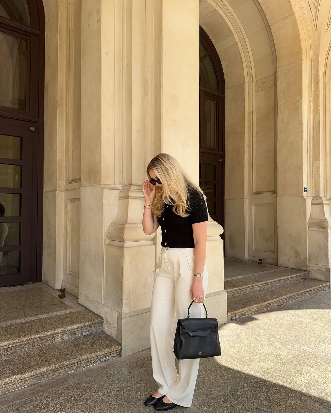Early fall outfits ideas 2026 Black Knit Top With Cream Wide-Leg Trousers