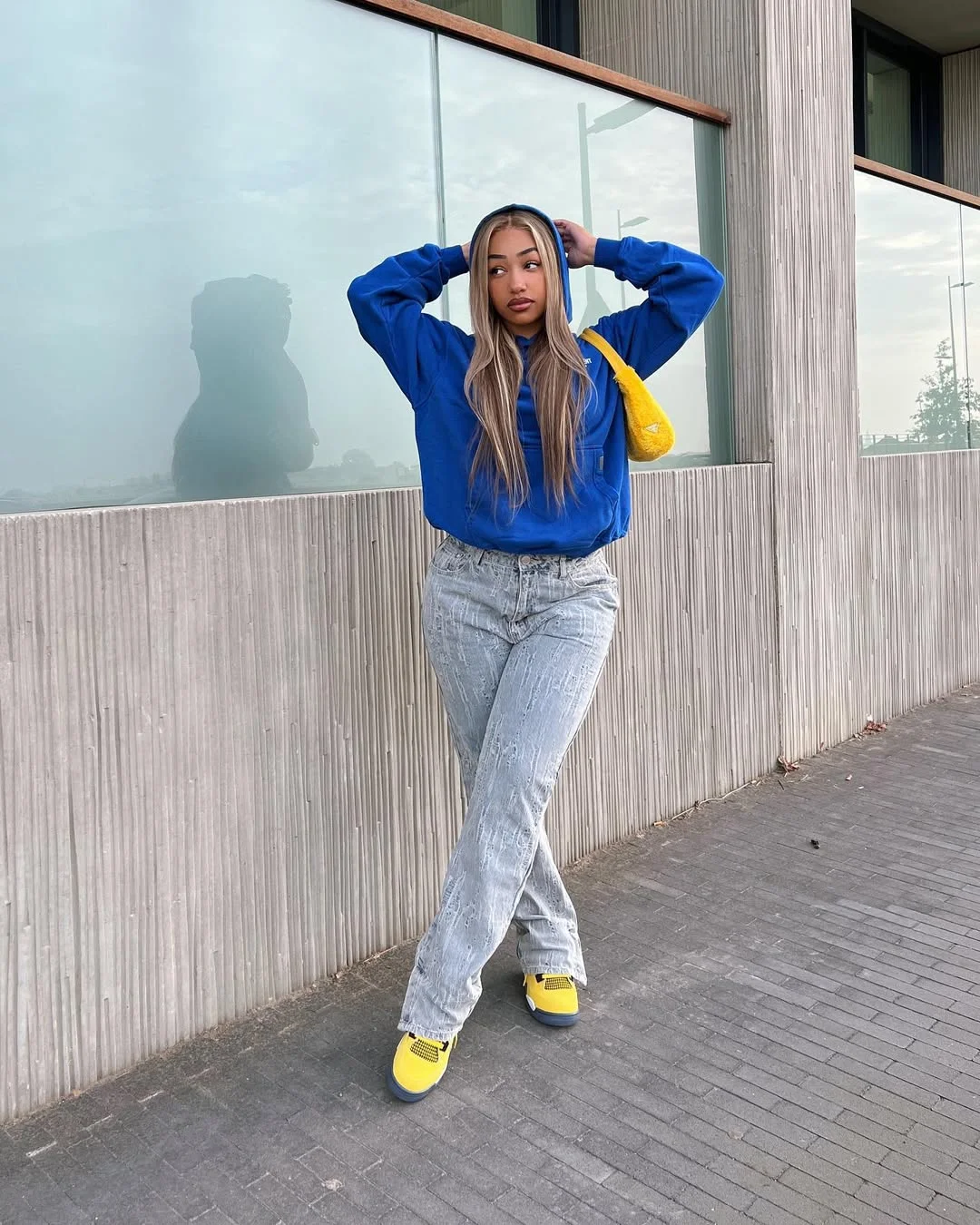Early fall outfits ideas 2026 Blue Hoodie With Washed Jeans And Bright Sneakers